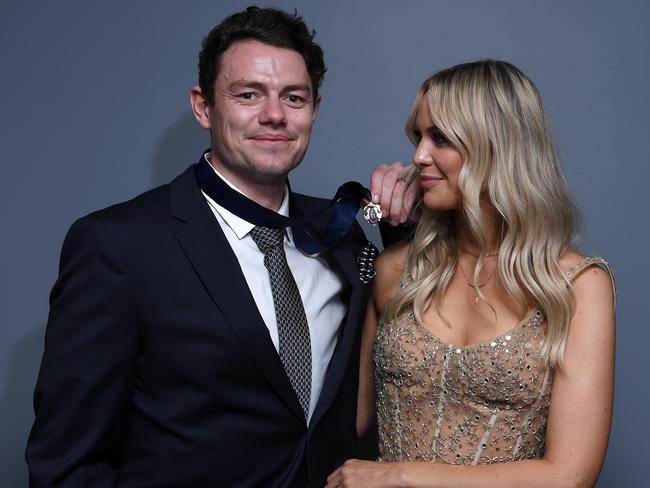 Lachie Neale of the Lions poses with his wife Julie Neale after winning the Brownlow Medal. Picture: Quinn Rooney