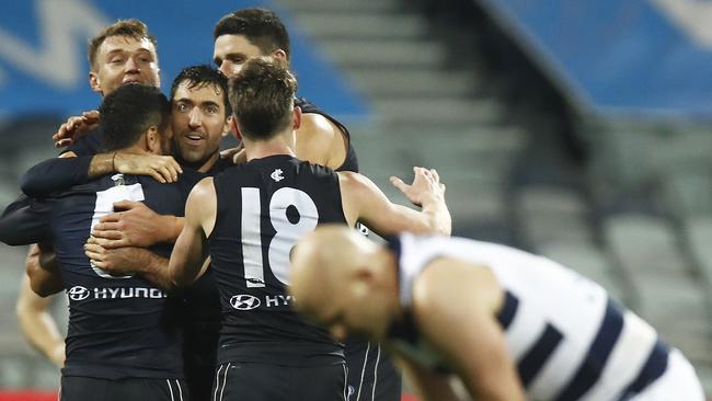 Blues players celebrate their upset victory over Geelong at GMHBA Stadium on Saturday night. Picture: Getty Images