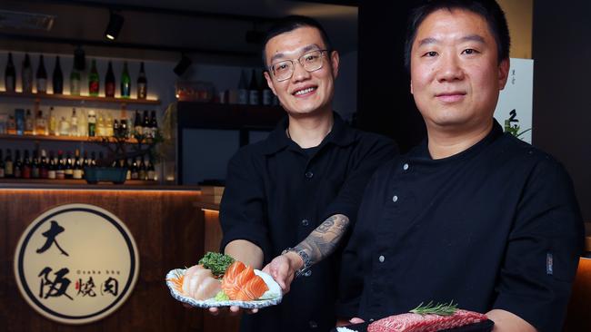 Osaka BBQ Torquay owner Allen Bo Li and owner chef Linson Shengmin Lin celebrate being in the top 10 of Geelong's best 100 restaurants. Picture: Alan Barber