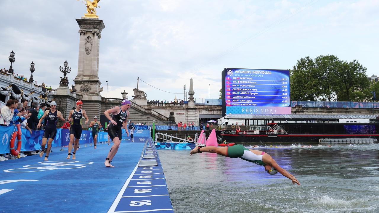 Competitors re-enter the water during the women’s triathlon. Picture: Getty Images