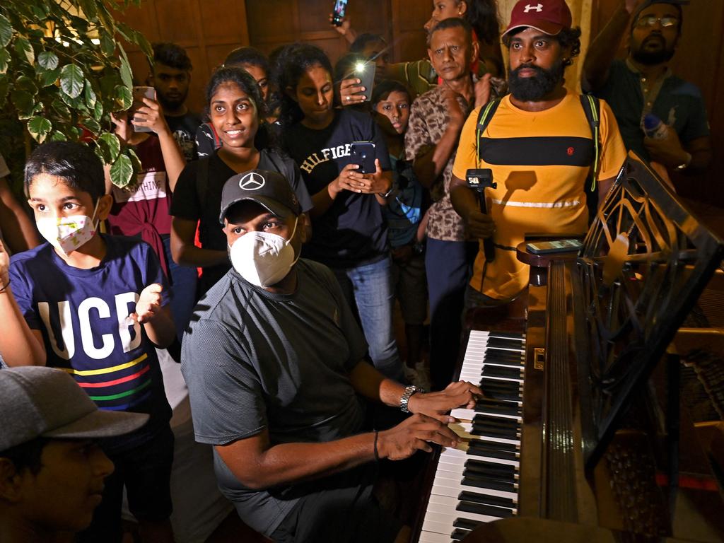 A protester plays a piano inside the Sri Lanka's presidential palace in Colombo. Picture: AFP