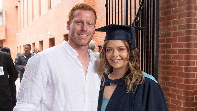 John Walker and Taylah Barrett celebrate graduation. Picture: Brad Fleet