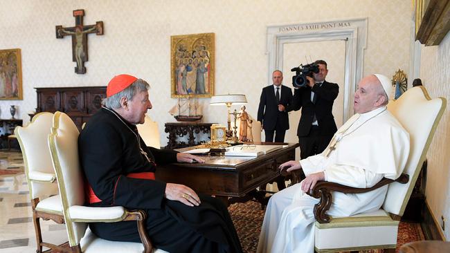 Pope Francis, right, talks with Australian cardinal George Pell during a private audience at the Vatican in 2020. Picture: Vatican Media/AFP