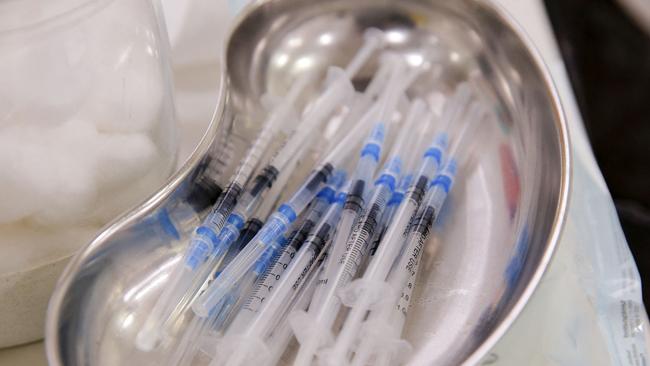 Syringes with a dose of the Pfizer-BioNTech vaccine against COVID-19 are seen at a vaccination centre on July 12, 2021. (Photo by JAVIER TORRES / AFP)