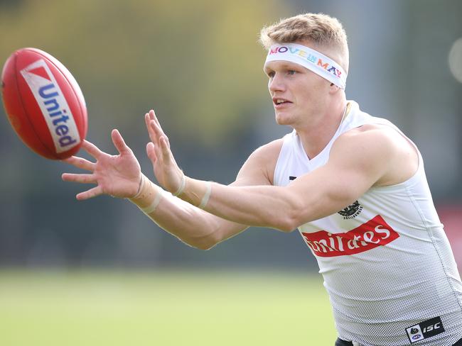 Collingwood training at Olympic Park...   Adam Treloar wearing a headband supporting the Move in May campaign    . Pic: Michael Klein.