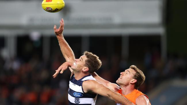 Tom Hawkins flies in a contested with Lachlan Keeffe.