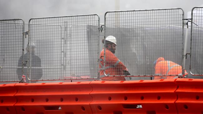 Workers and pedestrians on the light rail opposite Town Hall in George were engulfed in smoke one afternoon in July. Picture: John Grainger