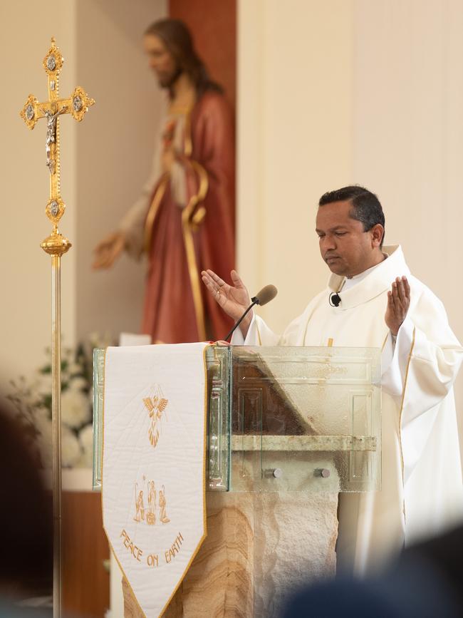 Father Suresh Kumar led prayers during