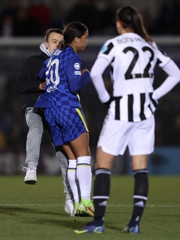 Sam Kerr took the matter into her own hands after security failed to keep him off the field and executed a perfect shoulder charge. Picture: Warren Little/Getty Images