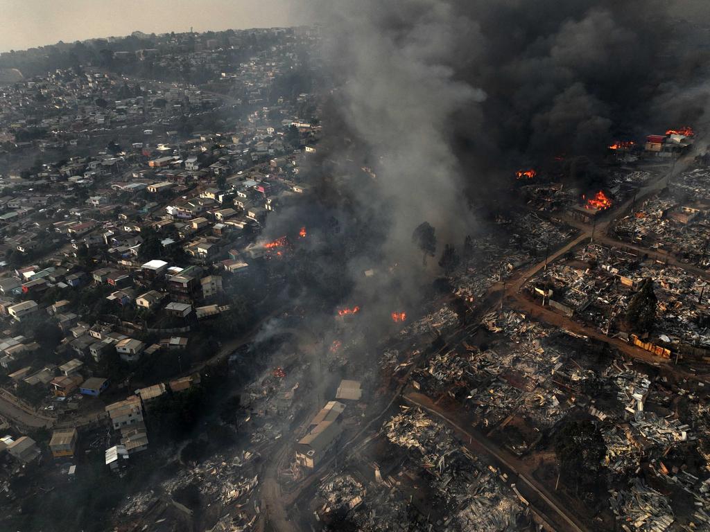 An aerial shot captures a forest fire in Viña del Mar, Chile, as the region experiences unprecedented blazes. Picture: Javier Torres/AFP