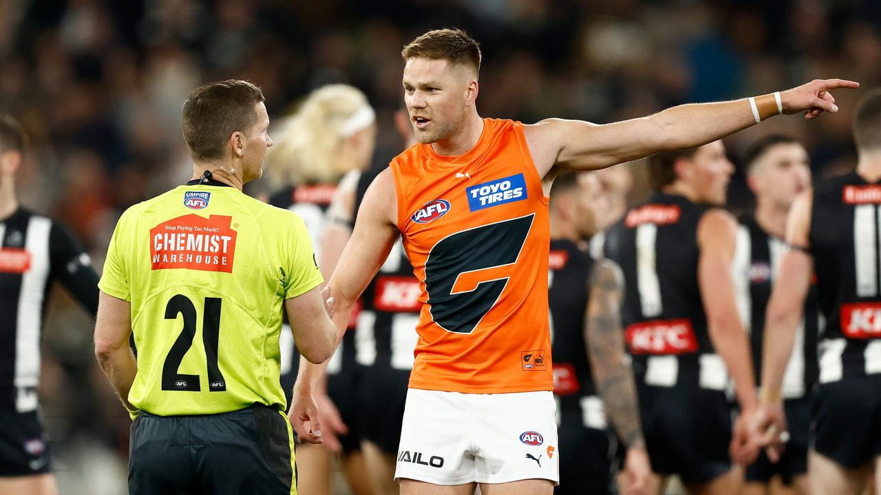 Harry Himmelberg of the Giants speaks with AFL Field Umpire Simon Meredith. (Photo by Michael Willson/AFL Photos via Getty Images)