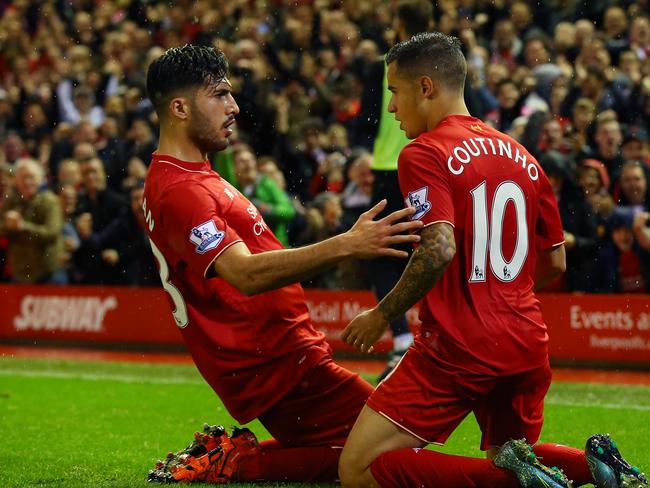 Philippe Coutinho of Liverpool (r) celebrates scoring his side's first goal.