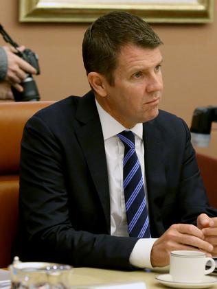 NSW Premier Mike Baird listens to Malcolm Turnbull.