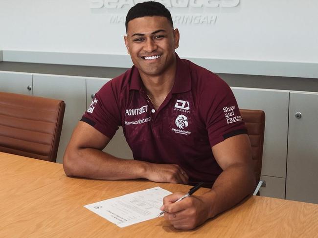 Olakau’atu inks his new deal. Picture: Manly Sea Eagles