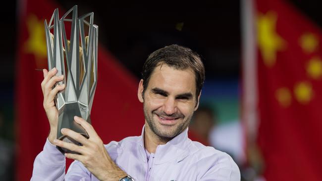 Roger Federer of Switzerland holds the trophy after winning his men's final singles match against Rafael Nadal of Spain at the Shanghai Masters.