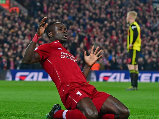 (FILES) In this file photo taken on February 27, 2019 Liverpool's Senegalese striker Sadio Mane celebrates after scoring the opening goal of the English Premier League football match between Liverpool and Watford at Anfield in Liverpool, north west England. - Premier League clubs will return to training in small groups from Tuesday after the latest stage of "Project Restart" was approved on Monday, May 18. (Photo by Anthony DEVLIN / AFP) / RESTRICTED TO EDITORIAL USE. No use with unauthorized audio, video, data, fixture lists, club/league logos or 'live' services. Online in-match use limited to 120 images. An additional 40 images may be used in extra time. No video emulation. Social media in-match use limited to 120 images. An additional 40 images may be used in extra time. No use in betting publications, games or single club/league/player publications. /