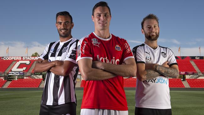 Adelaide City recruit Marcos Flores with Raiders defender Adam van Dommele and Para Hills captain Tyler Bailey. Picture: Naomi Jellicoe