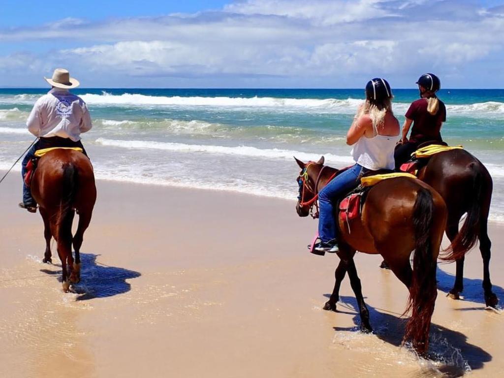 Andrew McCarthy guides his guests on a Rainbow Beach ride.