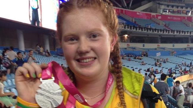 Alex Hulley of Rouse Hill shows off her silver medal she won in the hammer throw at the world youth olympics in Nanjing, china, on augu 24. Picture courtesy: Louise Hulley