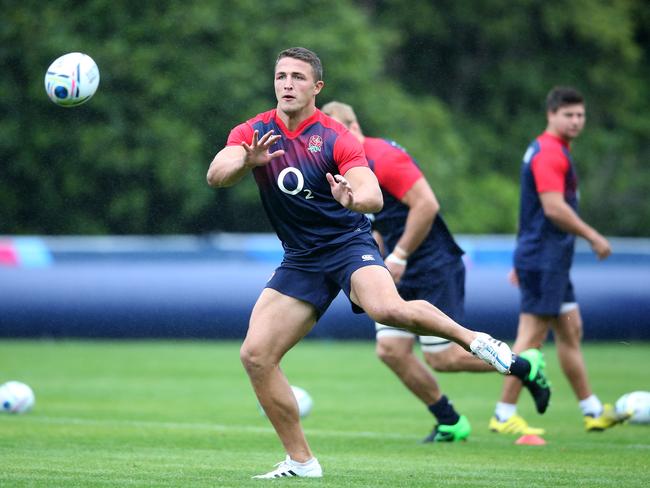 Sam Burgess catches the ball during the England training session at Pennyhill Park.