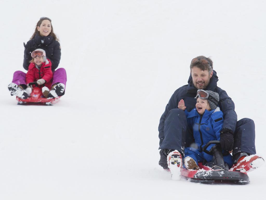 Prince Frederik and Princess Mary toboggan with the twins while on holiday in Verbier. Picture: Julian Parker/UK Press via Getty Images