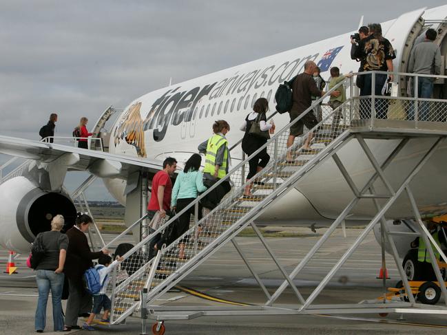 23 Nov 2007 Passangers board the first Tiger flight. Tiger Airways takes off at Melbourne Airport. Flight TT7402 to the /Gold /Coast, it was the first flight to depart from its home of Melbourne Airport. aviation aircraft airlines plane jet