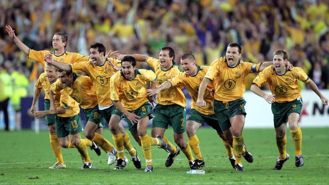 The Socceroos celebrate after John Aloisi scored the winning penalty against Uruguay to secure qualification to the 2006 World Cup. Picture: Gregg Porteous