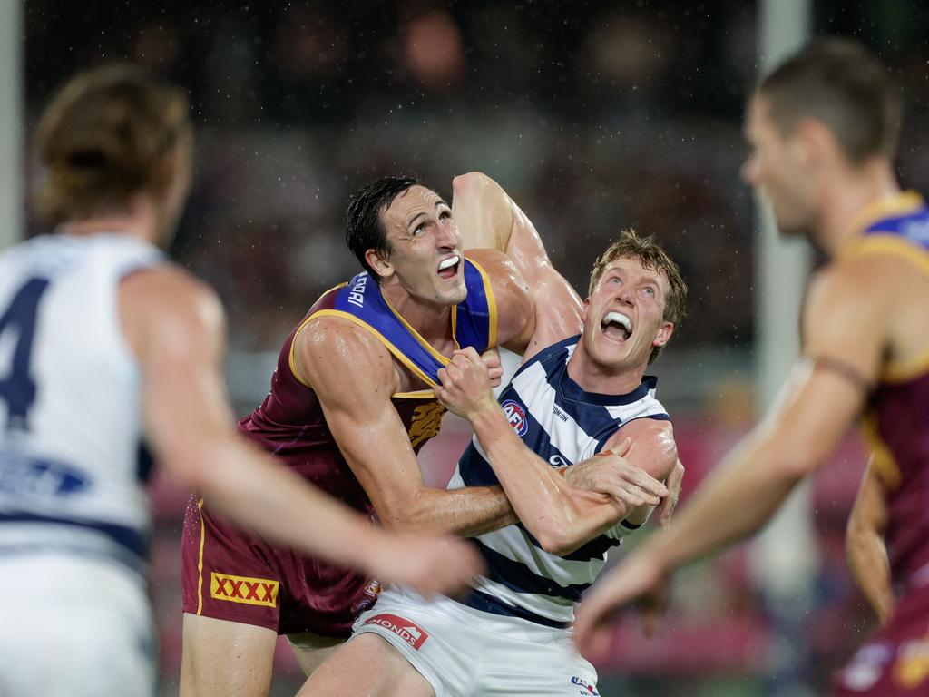 BRISBANE, AUSTRALIA - APRIL 20: Oscar McInerney of the Lions and Toby Conway of the Cats contest the ruck during the 2024 AFL Round 06 match between the Brisbane Lions and the Geelong Cats at The Gabba on April 20, 2024 in BRISBANE, Australia. (Photo by Russell Freeman/AFL Photos via Getty Images)