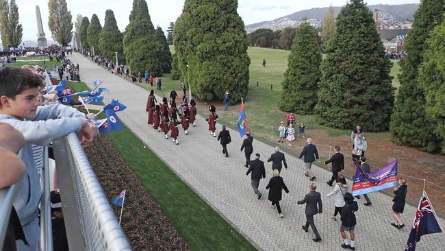 A large crowd gathered on the Bridge of Remembrance to watch those marching to the Cenotaph on Anzac Day in 2019. Picture: LUKE BOWDEN