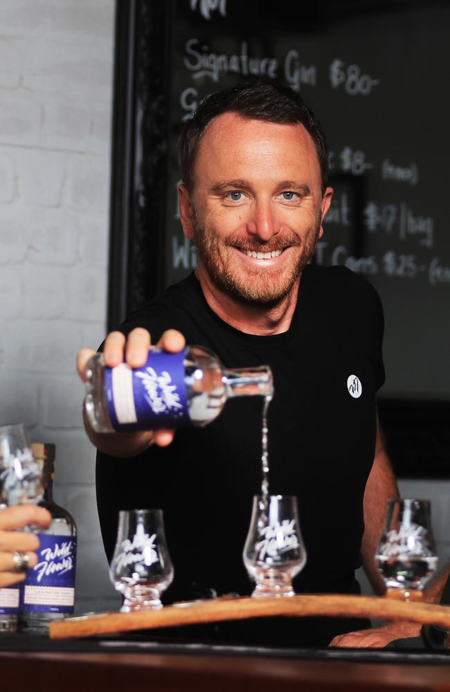21st January 2021, James Greig from local Burleigh distillery Wildflower Gin pours a drink lamington flavoured vodka they created. Photo Scott Powick Newscorp