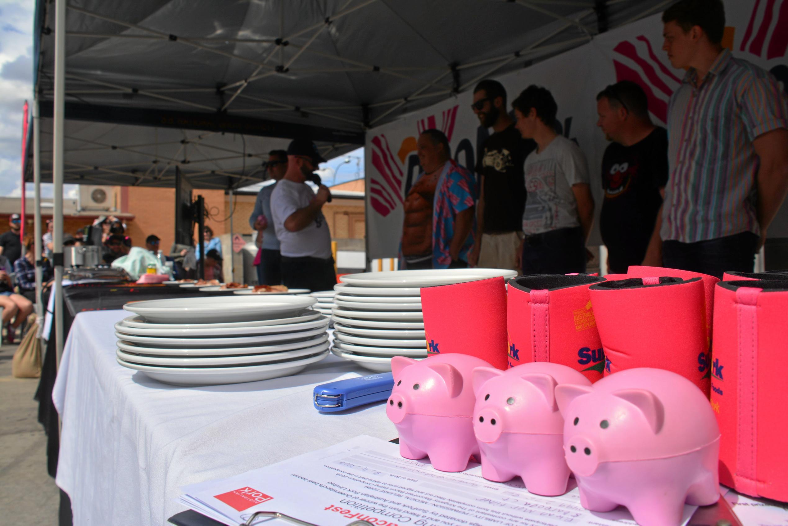 Competitors fight for the top spot at the bacon eating competition during Kingaroy's BaconFest on Saturday August 25. Picture: Jessica McGrath