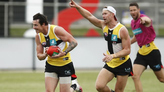 Jake Carlisle is trailed by new Saint Shaun McKernan. Picture: Getty Images