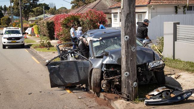 The car hit a fence then power pole. Picture: Julian Andrews