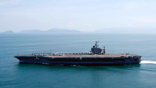 An aircraft carrier strike group led by the USS Abraham Lincoln, above, will replace one helmed by the USS Theodore Roosevelt in the region. Picture: US Navy via Getty Images