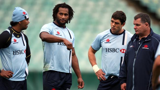 Lote Tuqiri talks to teammates as coach Ewen McKenzie (R) looks on during NSW Waratahs Super 14 team training session at the SFS in Sydney.