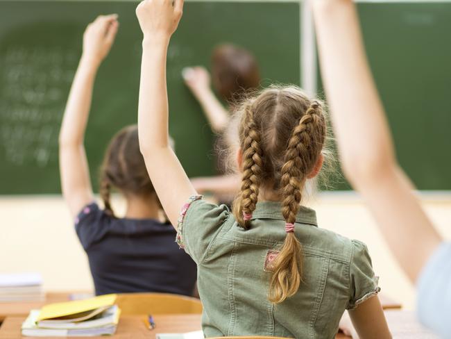 School children in classroom at lesson