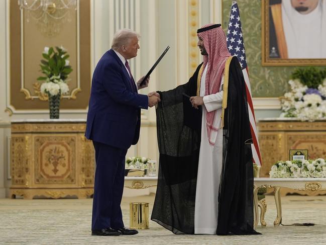 President Donald Trump and Saudi Crown Prince Mohammed bin Salman shake hands after exchanging documents during a signing ceremony at the Royal Palace in Riyadh, Saudi Arabia. Picture: AP Photo