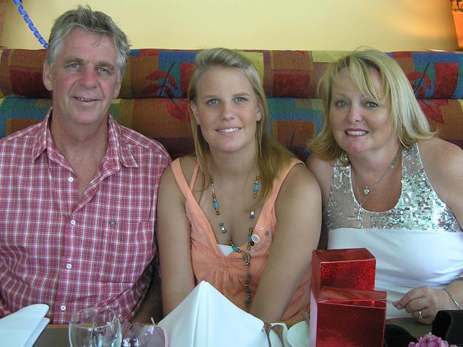 Maddie Riewoldt inbetween her mother Fiona and dad Joe Riewoldt at Christmas 2005.