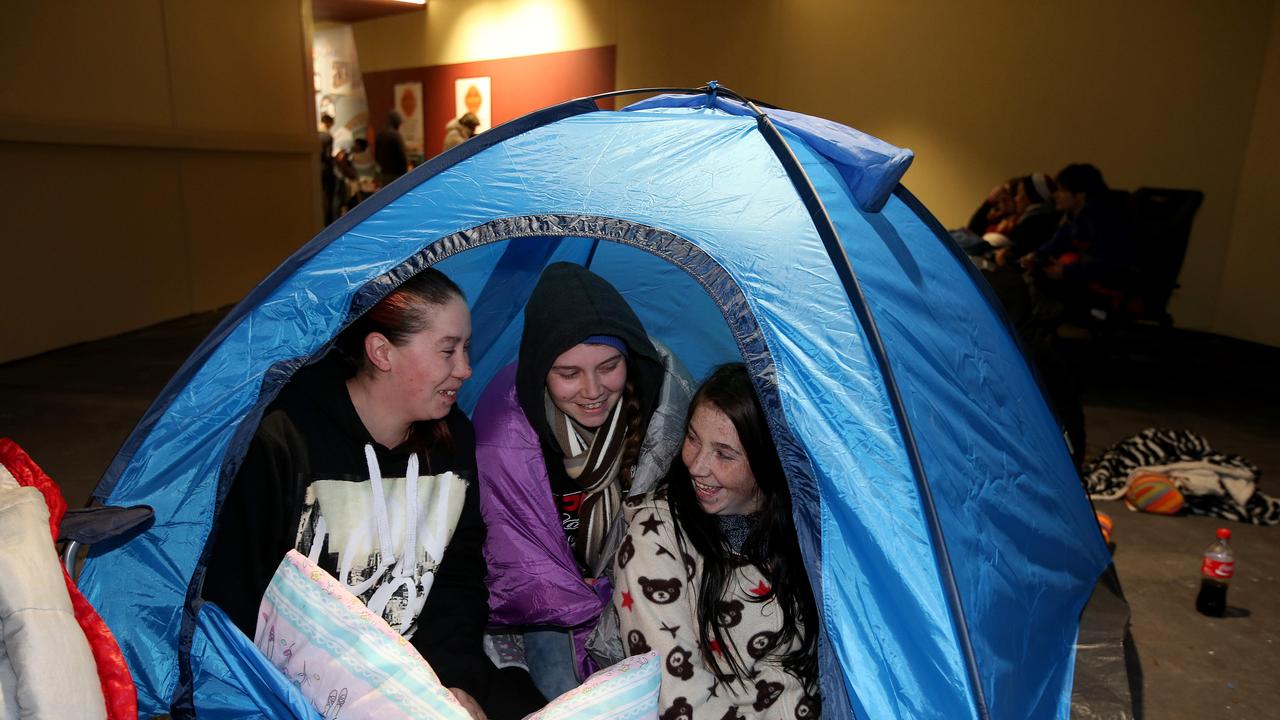 Carissa Blades, 24, Jessica Blades, 20, and Briana Scattergood, 21, camped out overnight at the opening. Picture: Simon Cross