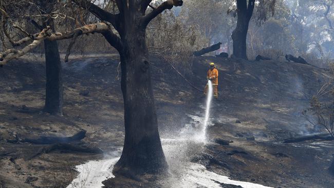 CFA firefighters after a fire impacted Clovemont Way, Bundoora in Melbourne. Picture: AAP