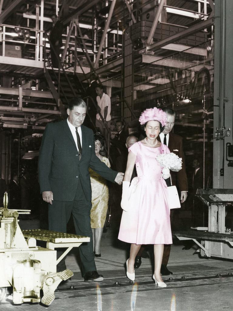 Queen Elizabeth II inspects the General Motors-Holden car plant at Elizabeth accompanied by Mr J. Kingston Stuart (left) on February 21, 1963.