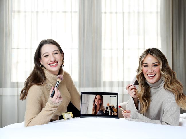 WEEKEND TELEGRAPHS SPECIAL. MUST TALK WITH PIC ED JEFF DARMANIN BEFORE PUBLISHING - Pictured at the QT Hotel in Sydney today is Amy Kaleski and Lou Hay in a virtual make-up consultation with Adore Beauty founder Joanna Fleming. Picture: Tim Hunter.