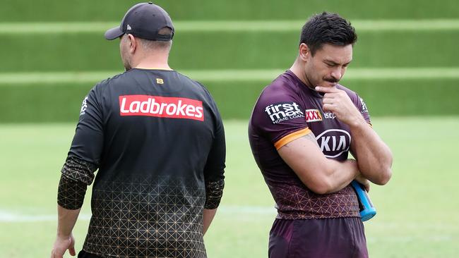 Captain Alex Glenn talking with coach Anthony Seibold.