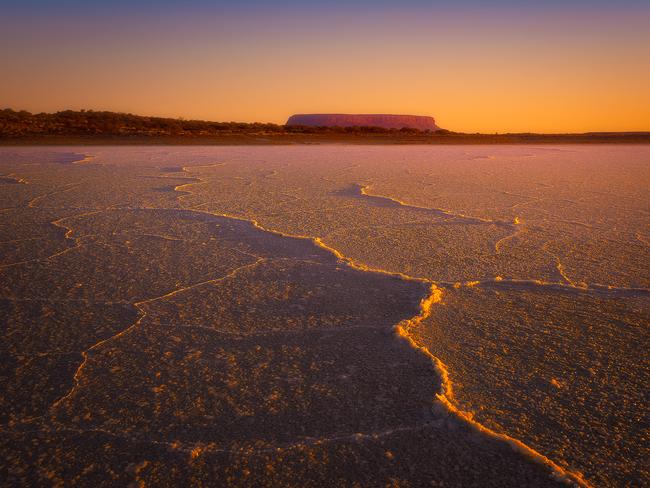 Just a short hours drive East from Uluru lies the equally impressive Mount Conner with salt flats. MUST CREDIT Picture: Matt Donovan/@itsworthashot