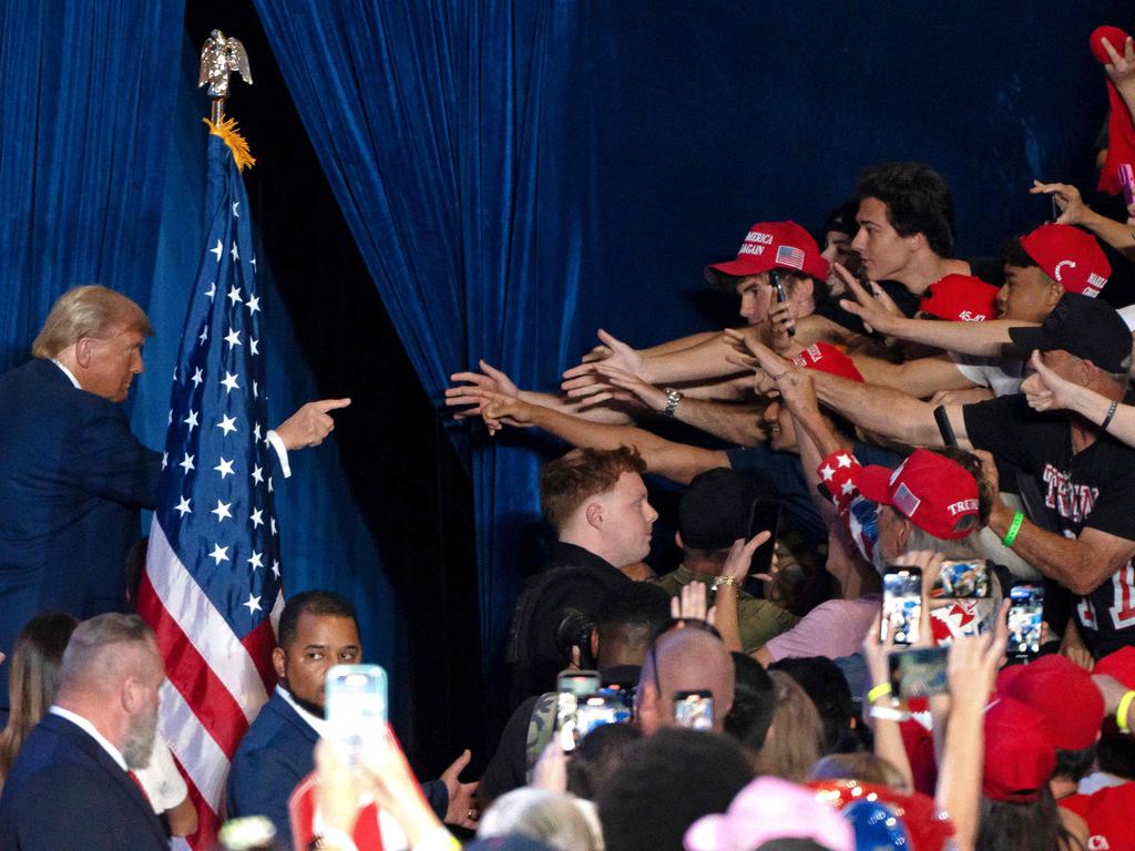 Former US President and Republican presidential candidate Donald Trump gestures at supporters as he exits the stage at the end of a campaign rally at Mullet Arena in Tempe, Arizona. Picture: AFP