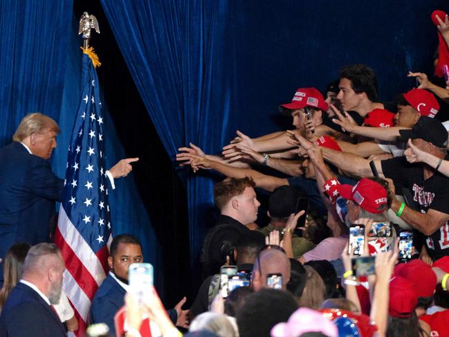 Former US President and Republican presidential candidate Donald Trump gestures at supporters as he exits the stage at the end of a campaign rally at Mullet Arena in Tempe, Arizona. Picture: AFP