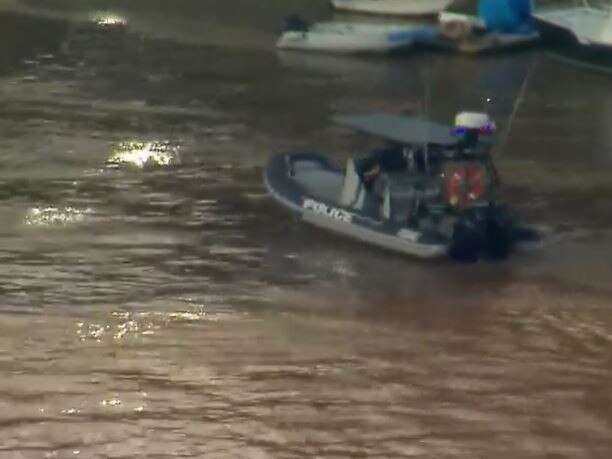 Police checking in the river and around embankments. Picture: 7News.