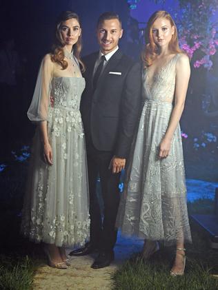 Paolo Sebastian with models Juliet Searle and Madison Stubbington, ahead of his Disney-inspired show for Adelaide Fashion Week at the Torrens Parade Ground. Picture: Tom Huntley