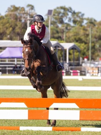 Hannah Cheal clears the planks at the 2023 PQC State Showjumping Championships.