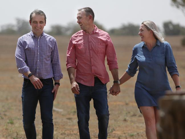 Commonwealth Bank CEO Matt Comyn with Ben and Jamee Wykes. Picture: Dean Marzolla